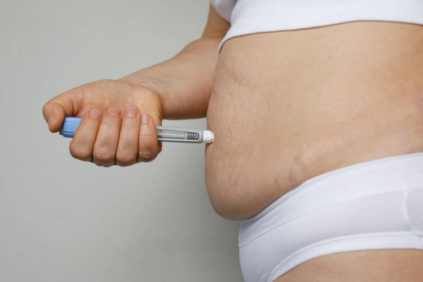 Injecting Ozempic for weight loss